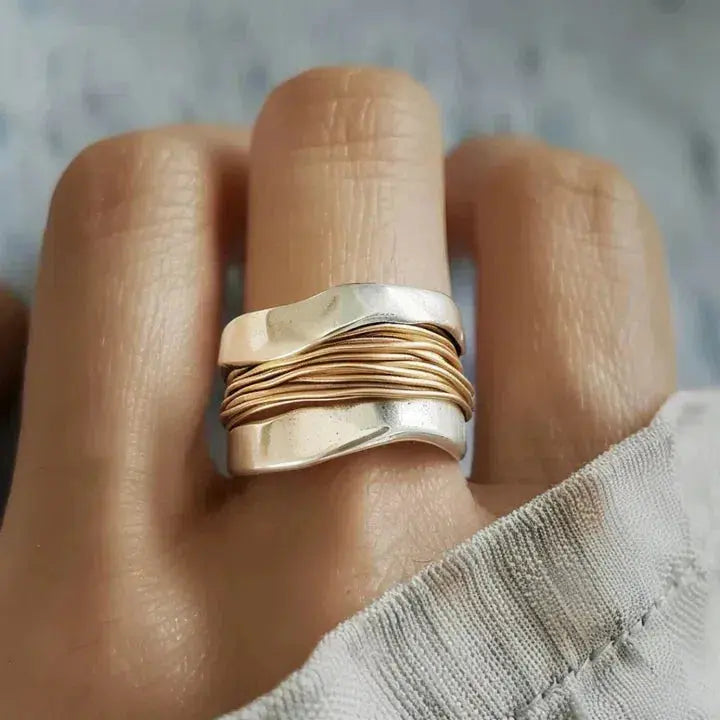 Silver ring with golden thread design